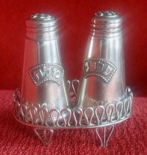 Salt and pepper shakers with - and,