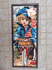 Cadre canevas "Poulbot facteur à vélo" mesurant 21 cm X 50,8 cm