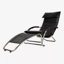 Fauteuil lounge design en cuir noir et acier chromé – bascule et repos