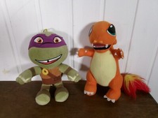 lot 2 peluches DRACAUFEU Pokemon 1996 et TORTUE NINJA DONATELLO 2017