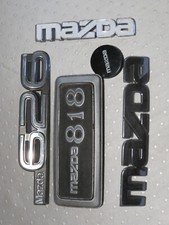 lot  sigles Mazda logo embléme 818 626 capot calandre coffre aile tableau bord ?