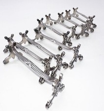 Ensemble de 9 Porte-couteaux  coquille styleLouis XIV Argentés signés CHRISTOFLE