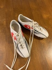 Chaussures de rugby marque Lotto taille 45, blanches, en bon état