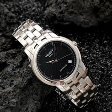 Nos montres TISSOT BALLADE III AUTOMATIC T97.1.483.51 cadran noir...