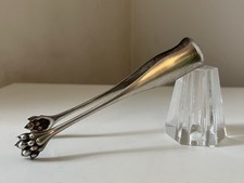 Pince à sucre en métal argenté pattes lion XIX