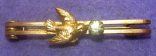 ancienne broche barrette figurant un oiseau tenant dans son bec un strass