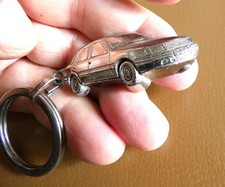 Ancien porte cle métal profil 3D Automobile Peugeot 309. Garage Besançon.