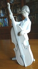 Figurine lladro ,enfant musicien  violoncelle .Signé .