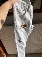 Jean blanc déchiré