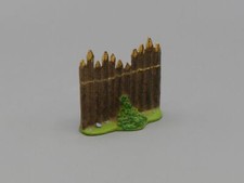 Palissade avec un buisson - Le