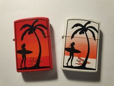 Lot 2 anciens briquets tempête vintage à essence décor surfeuse palmier