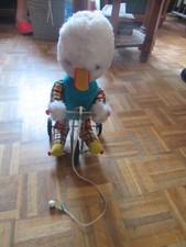 peluche canard  sur tricycle à tirer ancien
