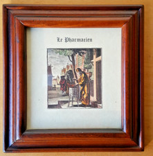 Petit cadre avec verre contenant la représentation d’un pharmacien d’autrefois