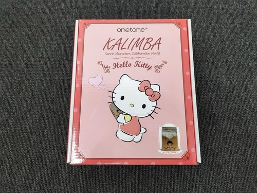 Hello kitty touches kalimba - kitty,