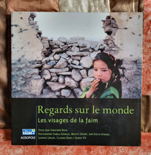 Livre  Regards sur le monde: Les visages de la faim / Broché 2004 / TBE