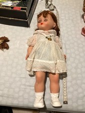 Poupée Bella 38 cm robe blanche à pois jaunes. Médaille Bella