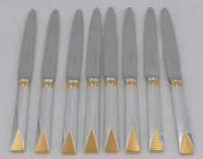 Christofle modèle Atlantide bague dorée, 8 couteaux à entremets/dessert/fromage.