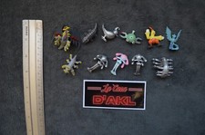 Lot 11 figurines Pokémon dont argentées Giratina Articodin Galifeu Magneti etc