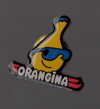 pin's orangina / ski (signé pub garcin. / époxy)