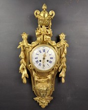 Cartel de style Louis XVI en bronze doré