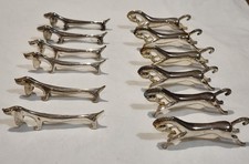 Lot de 12 repose couteaux en métal argenté 6 chiens Teckel et 6 chevaux /