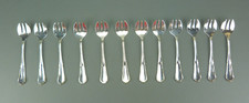 12 fourchettes à huitres en métal argenté, A.O, modèle Contours.