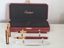 Must de cartier  Must, stylo à plume plume  en or 18 cts, et roller   bordeaux