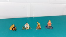 Lot 4 pins pin's gaston lagaffe teisseire parc astérix rombaldi poupée corolle