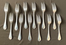 CHRISTOFLE 12 FOURCHETTES EN METAL ARGENTE MODELE RUBANS CROISÉS COUVERTS