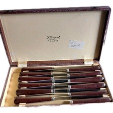 Coffret de 12 couteaux de table vintage manche en bakélite