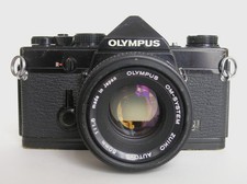 OLYMPUS OM-1n MD 24x36 ARGENTIQUE + 50mm/1,8  ZUIKO 35mm/2,8 et 135mm/3,5 Noir