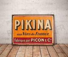 Plaque métal vintage Pikina