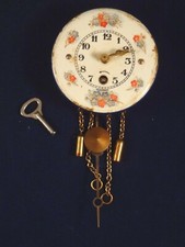 Ancien jouet pendule miniature mécanique maison poupée tôle émaillée Germany 20 
