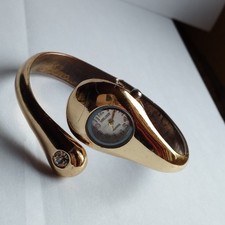 Montre femme MELODY  quartz bracelet rigide décor strass  pile incluse