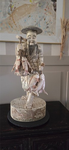Sculpture pêcheur os de - en,