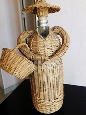 bouteille ancienne à eau de vie cachée sous vannerie Paysanne art populaire