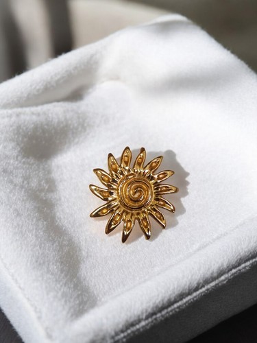 Broche vintage soleil doré