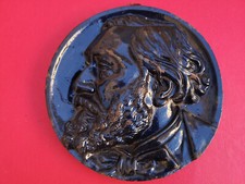 Plaque médaillon fonte