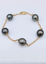 Bracelet or orné de 5 perles de culture grises  Or 750 Millième (18 CT) 8,96g