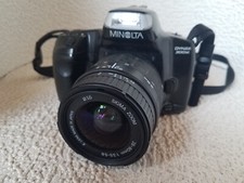 minolta dynax 300SI en assez bon état et fonctionnel avec sigma 28x80 aspherical
