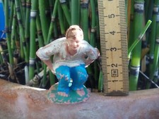 Caganer. Vintage Pooping