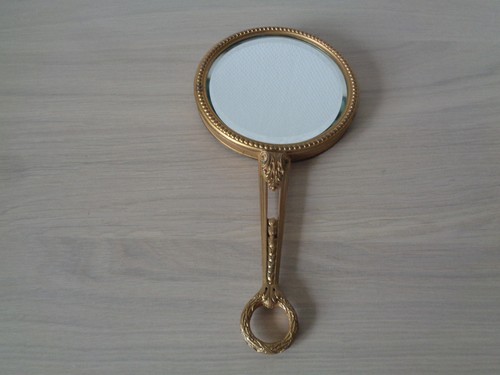 Miroir face main - face, a