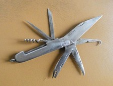 Ancien Couteau métal pliant multi fonctions.