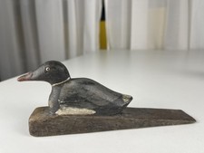 Figurine en bois canard cale