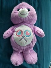 PELUCHE OURS BISOUNOURS MAUVE