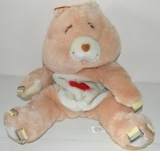 Peluche BISOUNOURS sac à dos