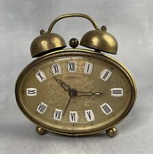 Ancien réveil ovale doré