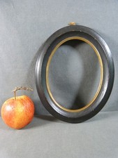 CADRE OVALE EN BOIS NOIRCI -