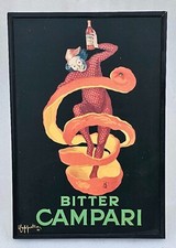 Réplique de clown apéritif amer Campari enveloppé dans une peau d'orange vint...