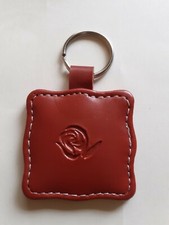 Joli et rare porte-clé rouge dessin rose de marque LE MONDE EN PARFUM 